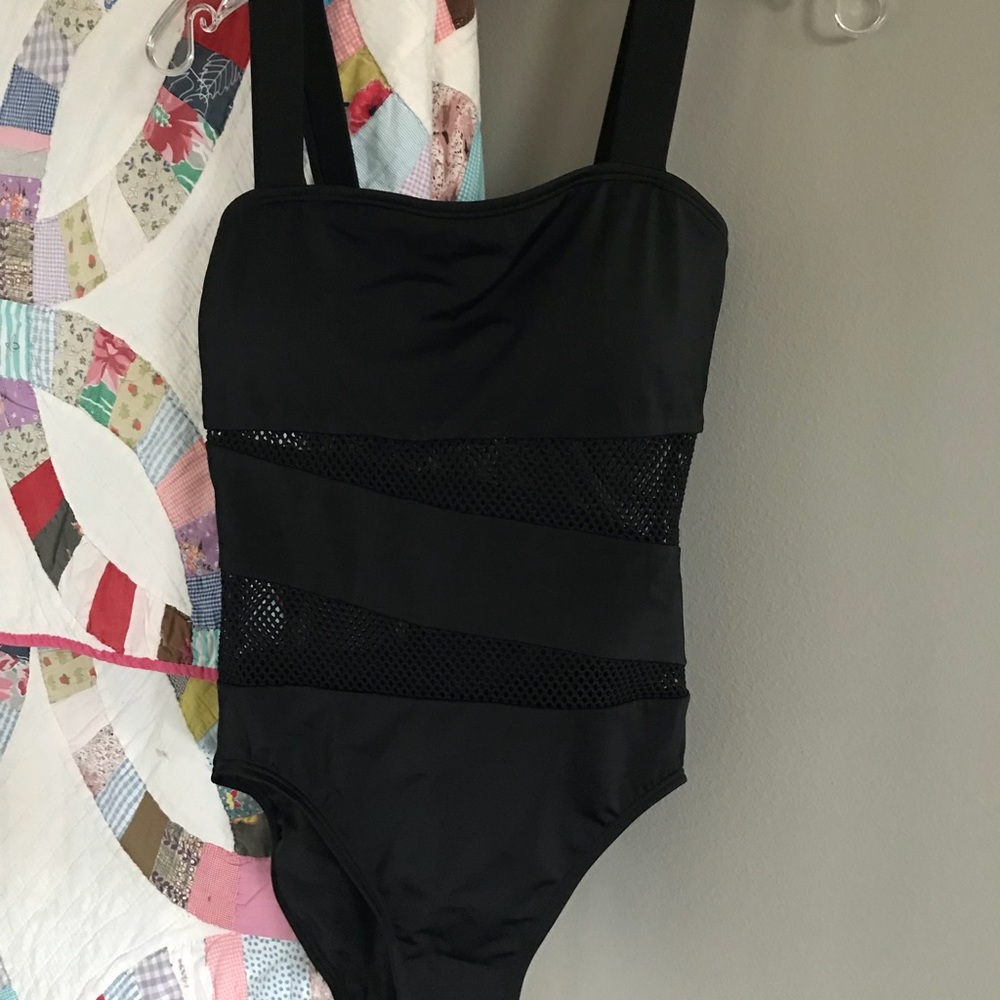 Never worn black suit, size 10, but fits size 6
